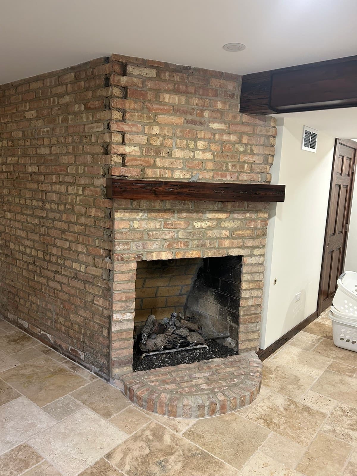 Restored brick exterior with repointed joints and rebuilt chimney on a Homer Glen, IL home by Paul Lally's Masonry