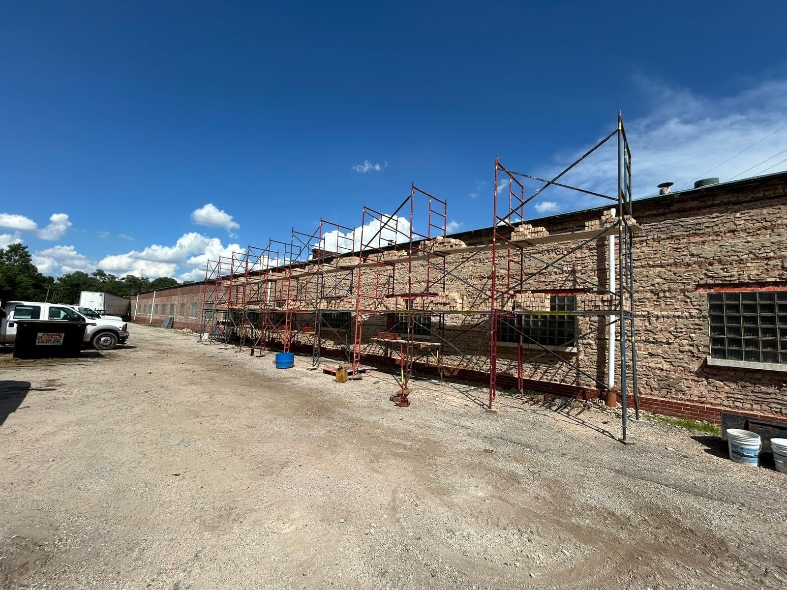 Rebuilt brick parapet wall with reset coping and new through-wall flashing in Burbank, IL