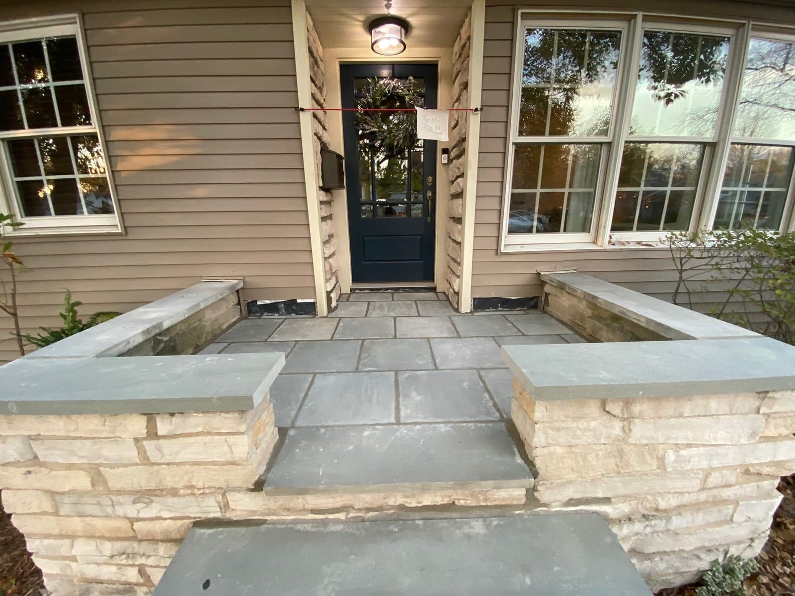 Fresh joint sealant tooled around a brick window perimeter on a Naperville, IL home by Paul Lally's Masonry