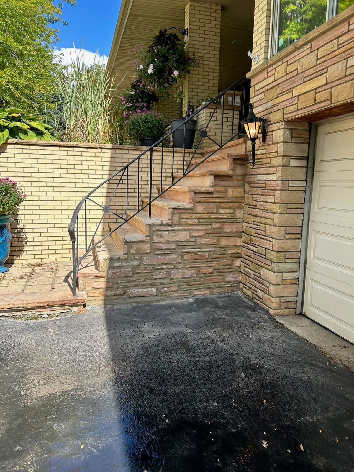 Fresh joint sealant tooled around a brick window perimeter on a Palos Heights, IL home by Paul Lally's Masonry